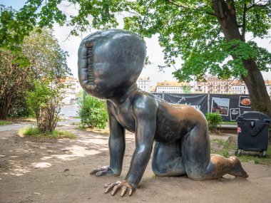 Prague, Czech Republic - June 2022: Famous sculpture Crawling Babies in Kampa Park museum, in Prague