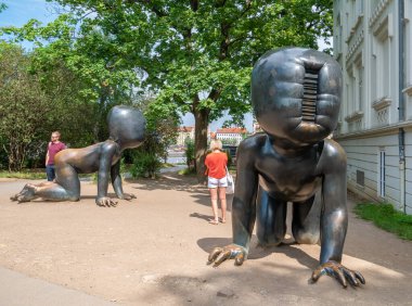 Prague, Czech Republic - June 2022: Famous sculpture Crawling Babies in Kampa Park museum, in Prague