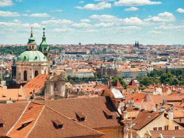 Beautiful aerial view with the old town city of Prague. Many traditional houses with red roof tiles.