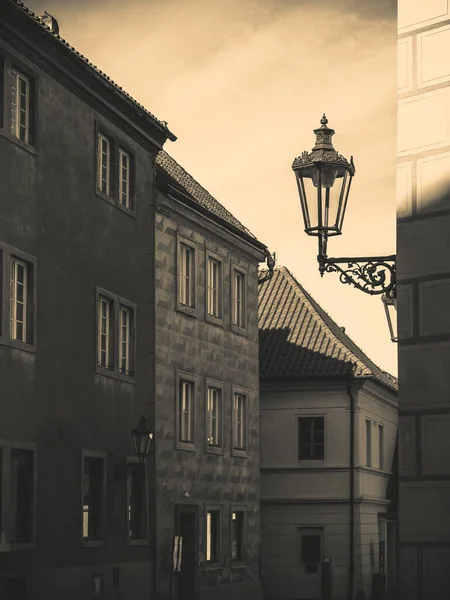 Old street light lamp in Prague, Czech Republic. Vintage monochrome picture from the old town of Prague