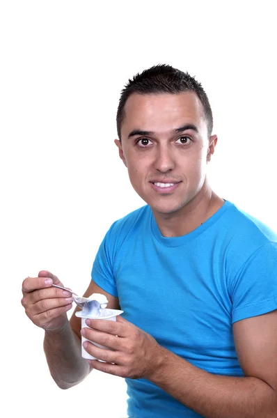 Giovane latino mangiare uno yogurt — Foto Stock