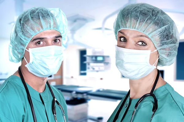 Male and female surgeons — Stock Photo, Image