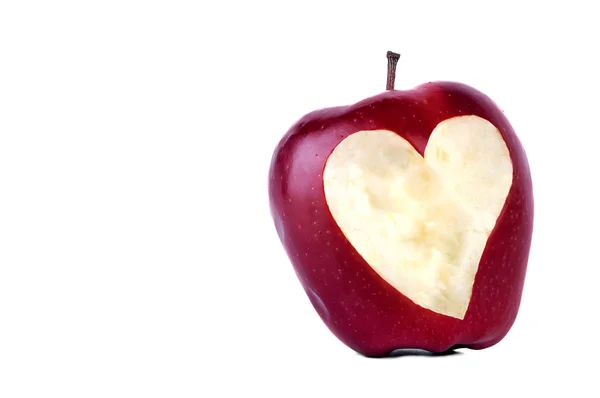 Apple with a carved heart. — Stock Photo, Image