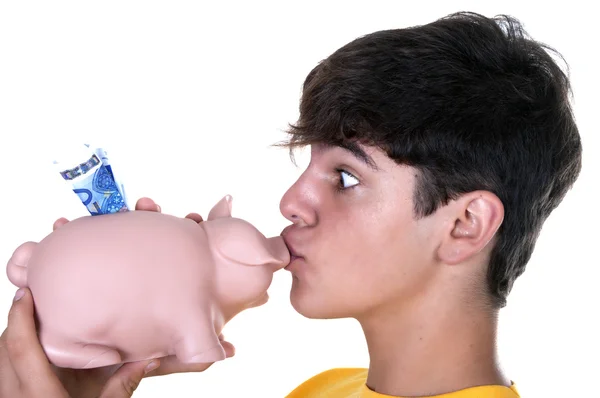 Menino beijando um porquinho banco — Fotografia de Stock