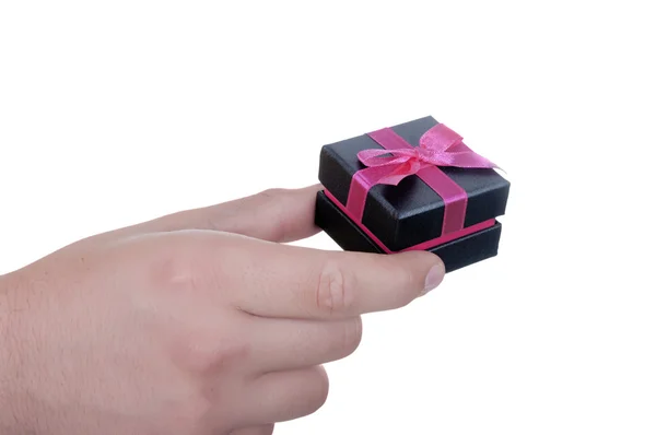 Confezione regalo in mano con nastro — Foto Stock