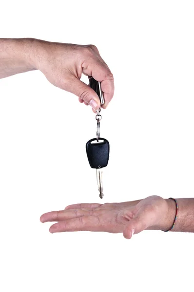 Female hand giving car key to male hand — Stock Photo, Image