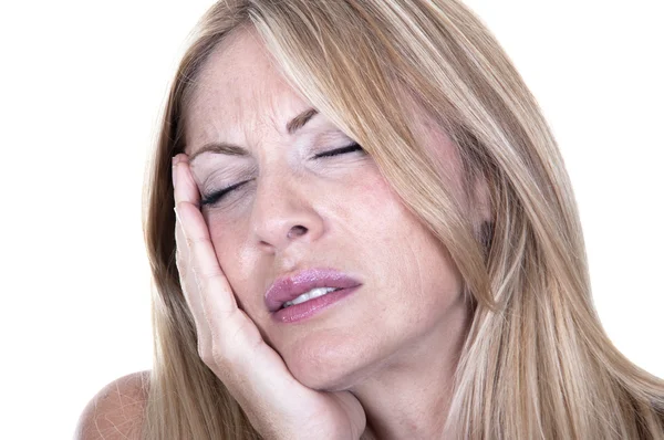 Blonde woman in pain is having toothache Stock Image