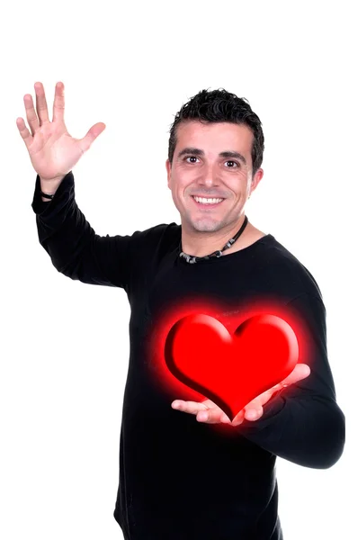 Homem sorridente com o coração de Valentin na mão — Fotografia de Stock