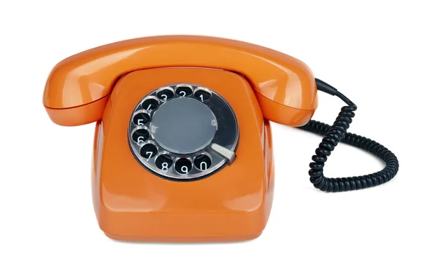 En gammal orange telefon — Stockfoto