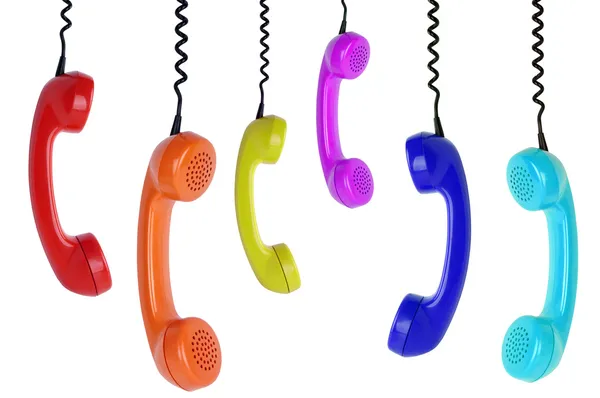 Seis telefones coloridos pendurados — Fotografia de Stock