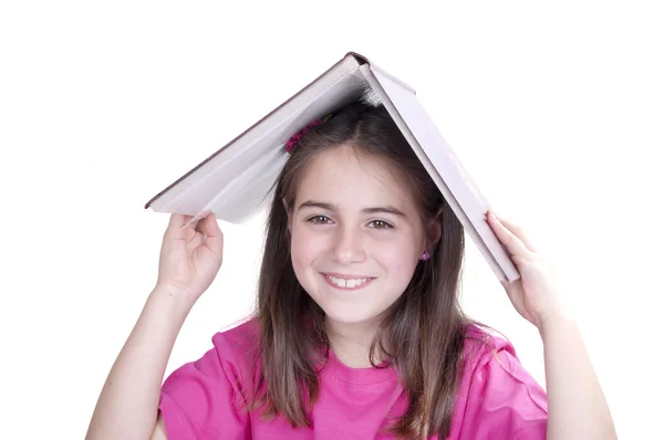 Fille avec un livre ouvert sur la tête — Photo