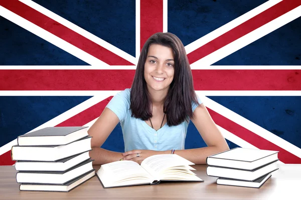 Young girl student pc on the background with UK flag — Stock Photo, Image