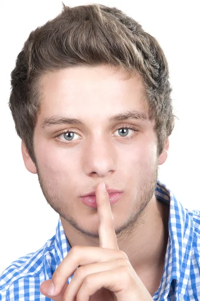 Adolescente menino fazendo um gesto silencioso — Fotografia de Stock