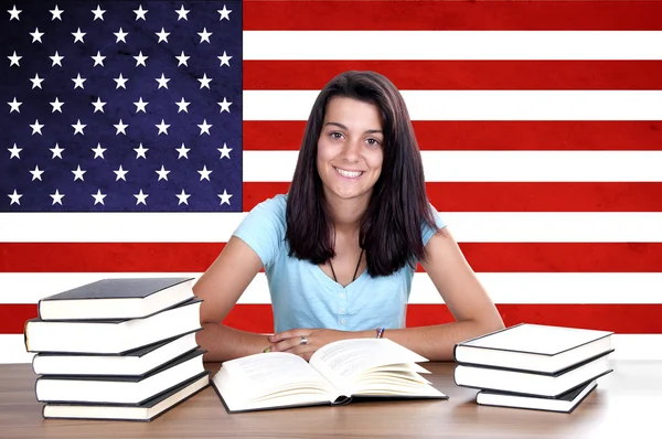 Young girl student pc on the background with American flag — Stock Photo, Image