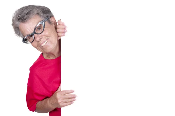 Senior female with a blank billboard — Stock Photo, Image