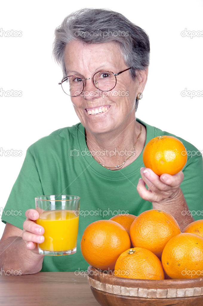 old smiling woman with orange juice 