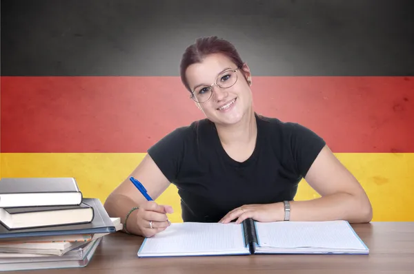 genç kız öğrenci germanl bayrağı ile arka planda
