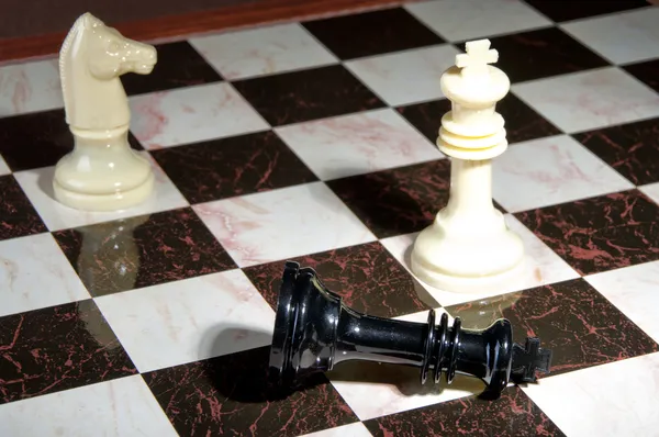 Chess pieces on wood board — Stock Photo, Image