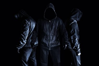 Photo of scary horror stranger stalker men in black hood and clothing on dark and misty background. clipart