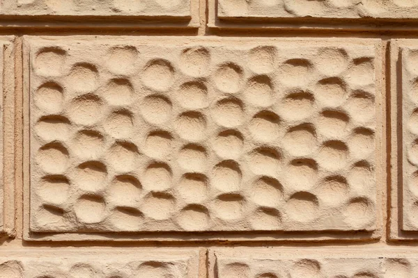 Close Zdjęcie Tekstury Beżowej Malowanej Powierzchni Ściany Cegły Okrągły Ornament — Zdjęcie stockowe