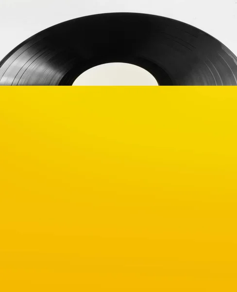 Foto Von Schwarzer Platte Mit Gelbem Cover Auf Weißem Hintergrund — Stockfoto