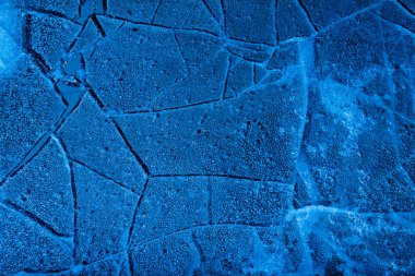 Üst görüntü mavi tonlu donmuş buz yüzeyinin dokusu..