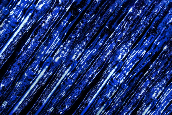 Foto Van Blauw Getinte Bevroren Ijspegels Abstracte Textuur Donkere Achtergrond — Stockfoto