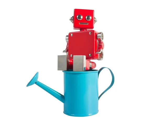 Foto Juguete Robot Metal Color Rojo Sentado Una Regadera Azul —  Fotos de Stock