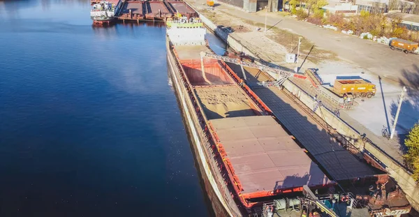 Large international transportation vessel in the port, loading for export in the sea waters. download image