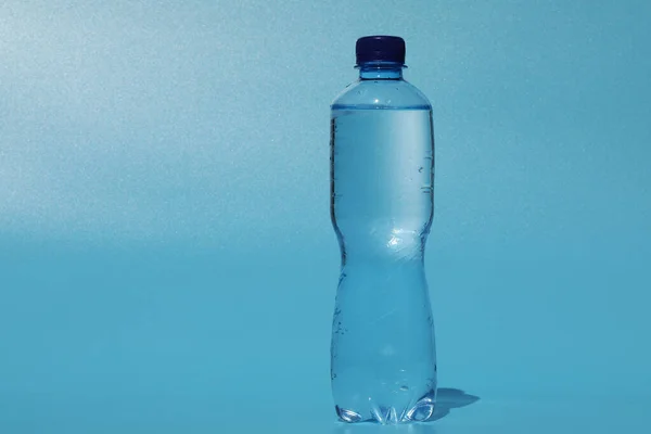 Bottle Cold Water Blue Background — стоковое фото
