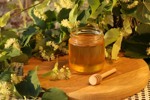 jar of linden honey with linden blossom