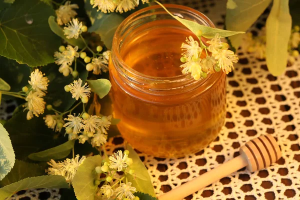 jar of linden honey with linden blossom