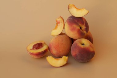  peaches on the pink background with copy space