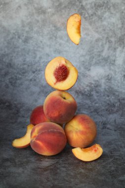  peaches on the grey background with copy space