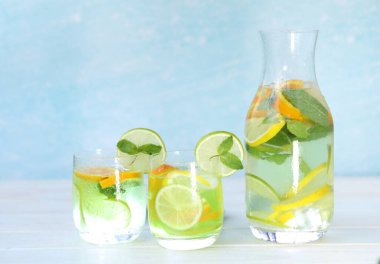 cold citrus lemonade with ice, lemon, mint, lime and orange