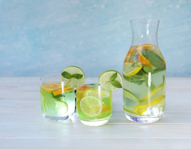 cold citrus lemonade with ice, lemon, mint, lime and orange