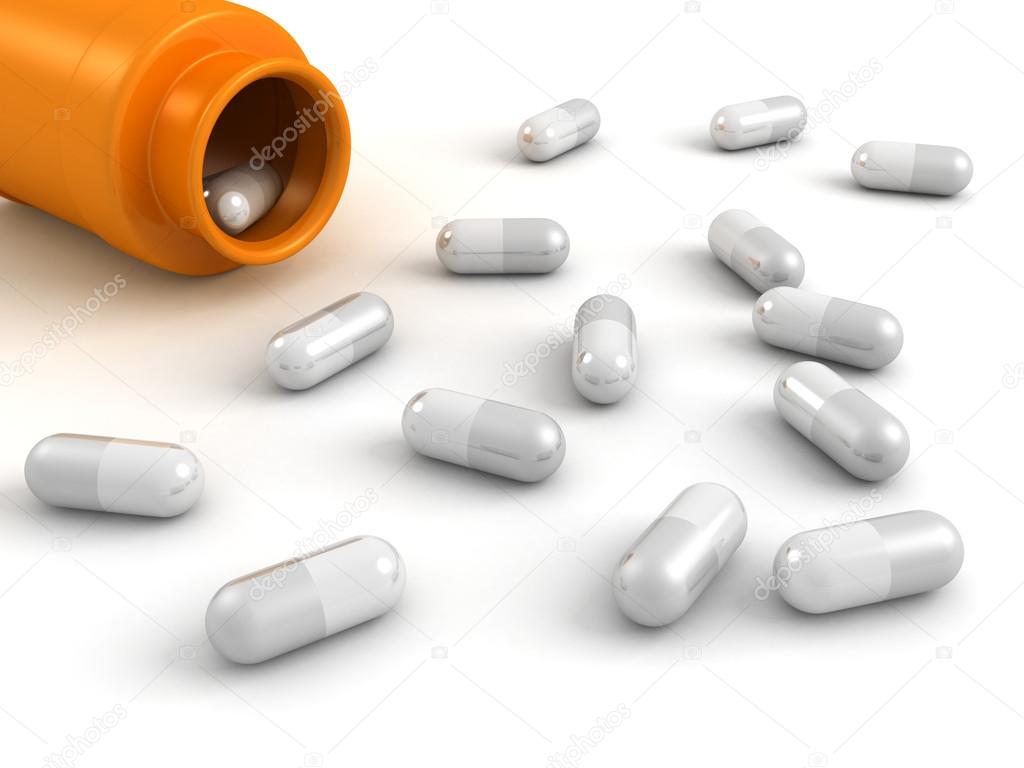 white ills spilling out of orange pill bottle