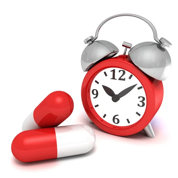 Alarm clock and    pills — Stock Photo, Image