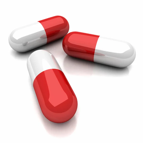 Pílulas médicas em fundo branco — Fotografia de Stock
