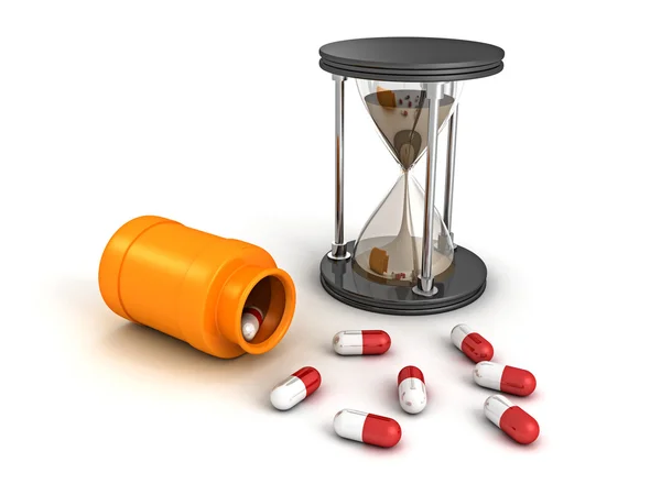 Reloj de arena y botella con pastillas médicas — Foto de Stock