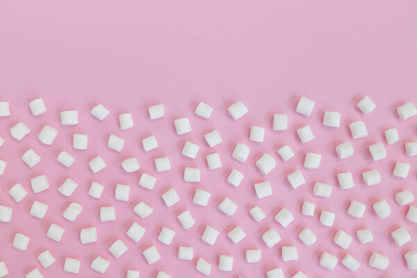 white mini marshmallows background frame, copy space for text, top view