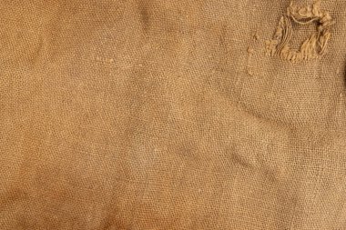 Arka plan için çuval bezi kumaş üst görünümü, kahverengi çuval örtüsü arka plan, yakın plan, delikli eski kumaş