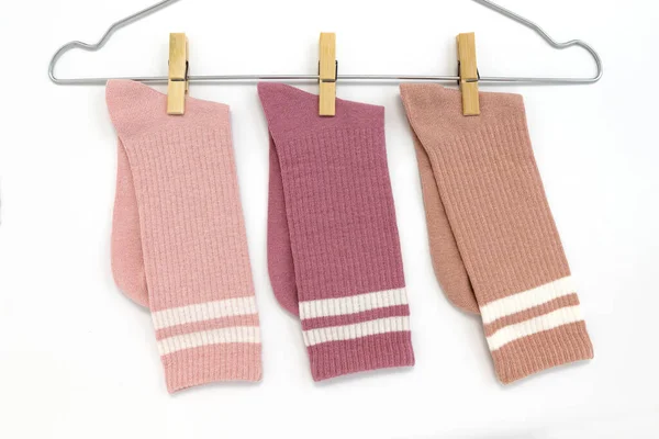 Three Cotton Beige Pink Red Socks Hanger Clothespins Isolated White — Stock Photo, Image
