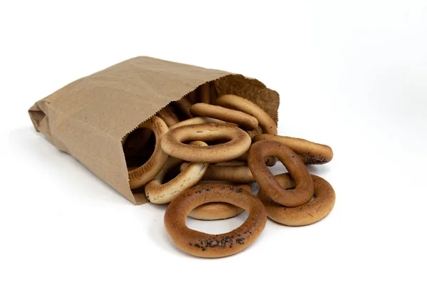 Pila Rosquillas Con Semillas Amapola Una Pequeña Bolsa Papel Aislada — Foto de Stock