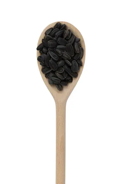 Černá Slunečnicová Semena Dřevěné Lžíci Izolované Bílém Pozadí Horní Pohled — Stock fotografie