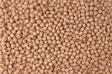 Nohut arkaplan, sağlıklı vejetaryen gıda konsepti, pişmemiş nohut yığını, üst manzara.