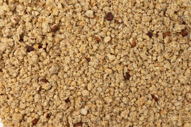 Granola Müsli 'nin arka planı, yakın çekim, üst görüş, konsept sağlıklı gıda, kahvaltı gevrekleri