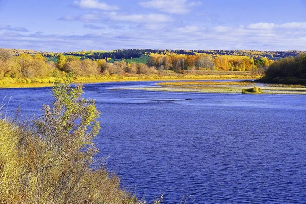 Crimson and gold-clad forests on the banks and in the valley of the pure Ural river Sylva (Kishert district, Perm region)