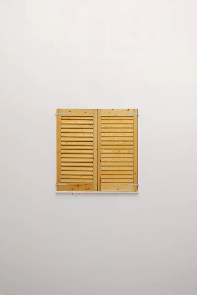 wooden window in white wall