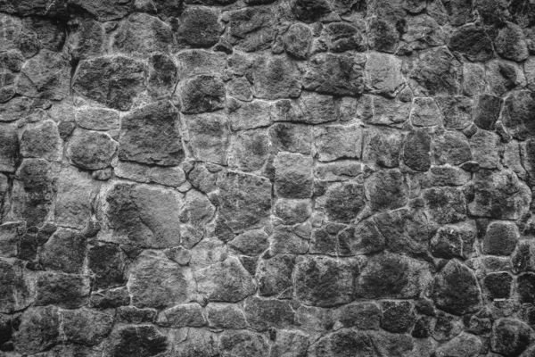 要約伝統的な石の壁舗装テクスチャの背景 旗石とスラブ石で作られたでこぼこの質感の石壁 — ストック写真